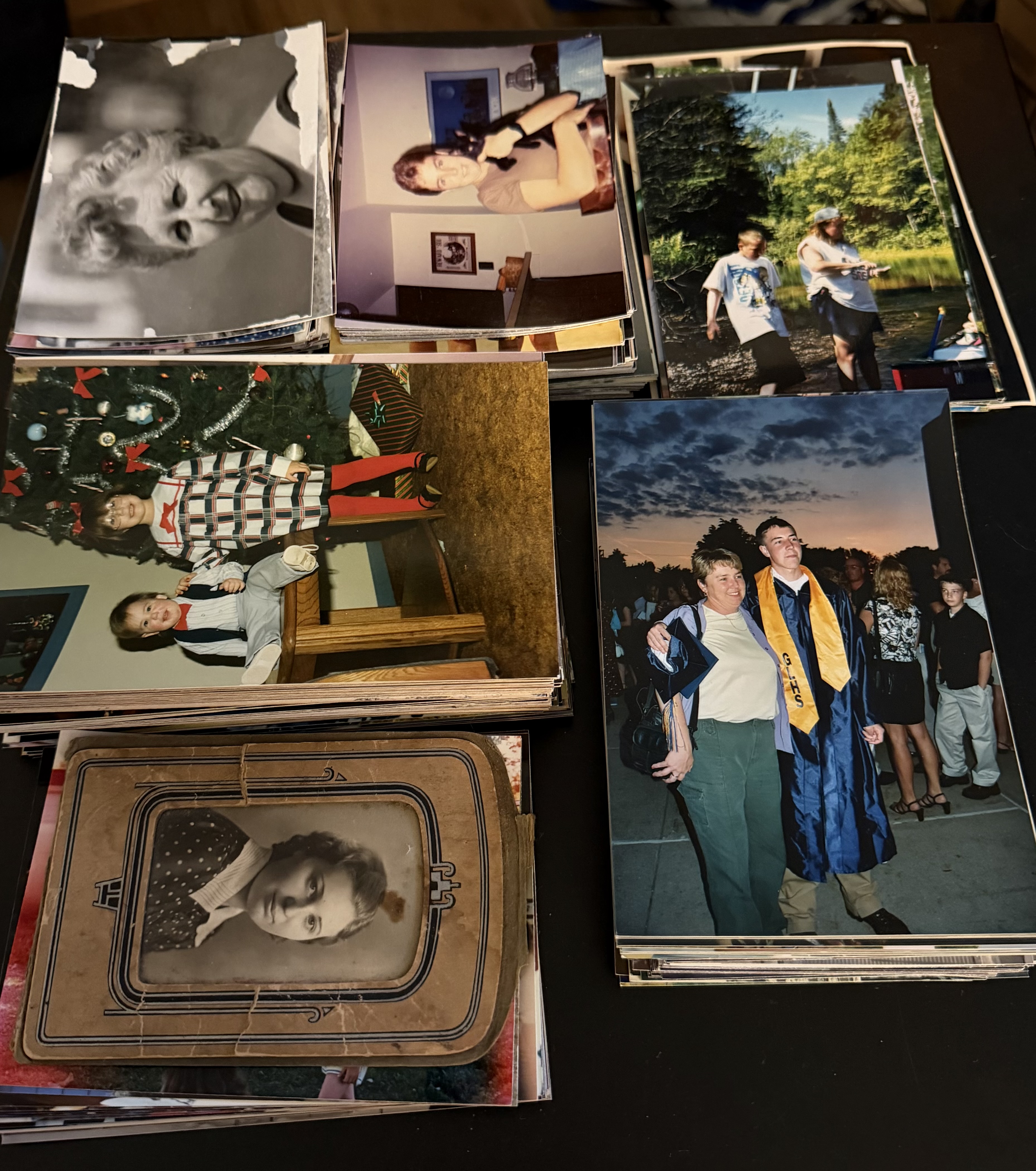 Stack of family photo prints sorted and ready for scanning